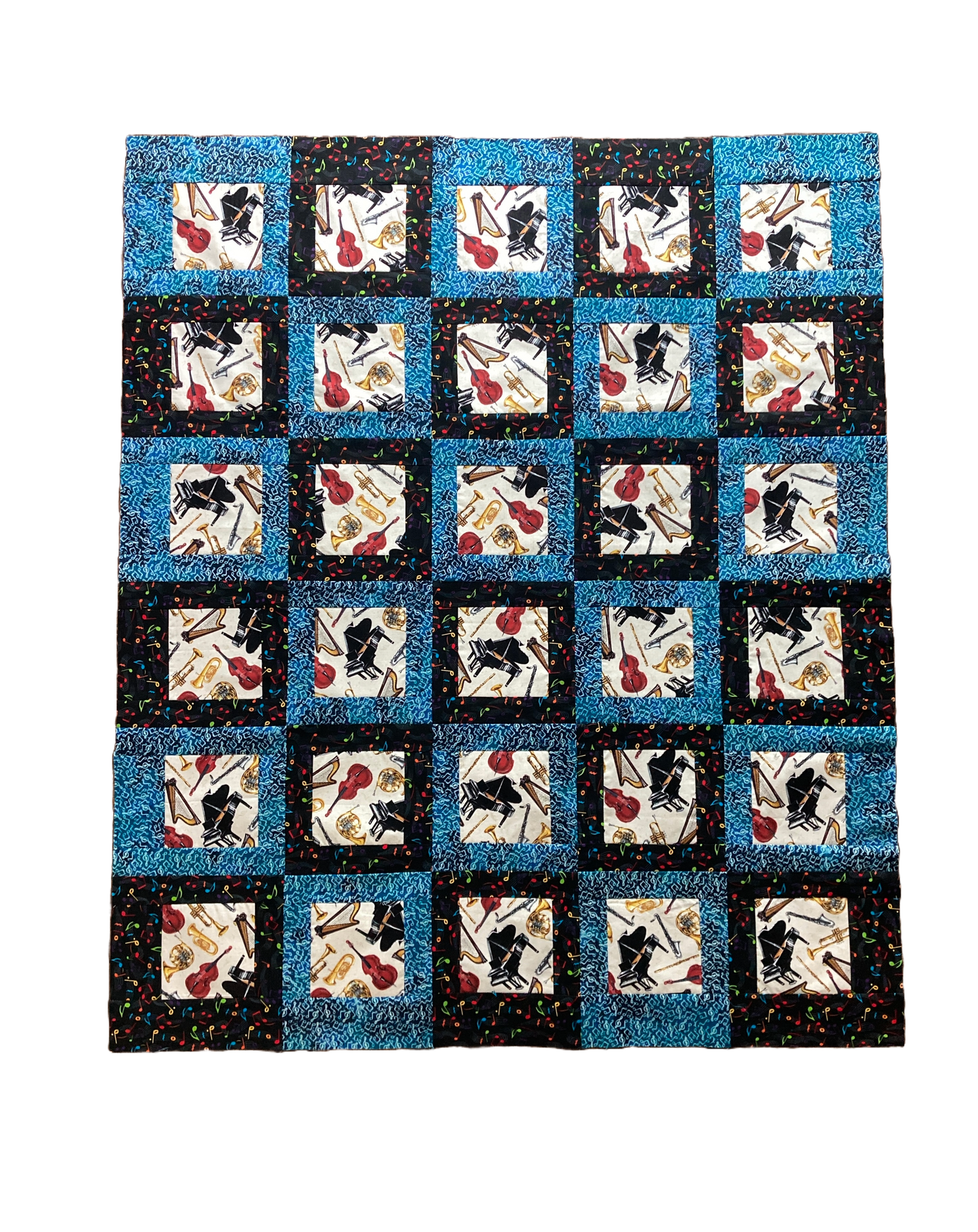 Moments Captured quilt in music themed fabric.