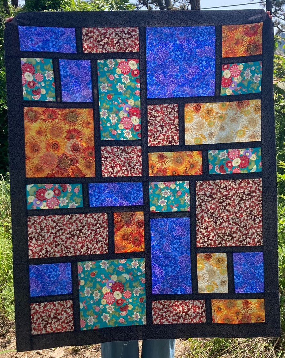 Slea Head Quilt, Baby size in metallic and black.