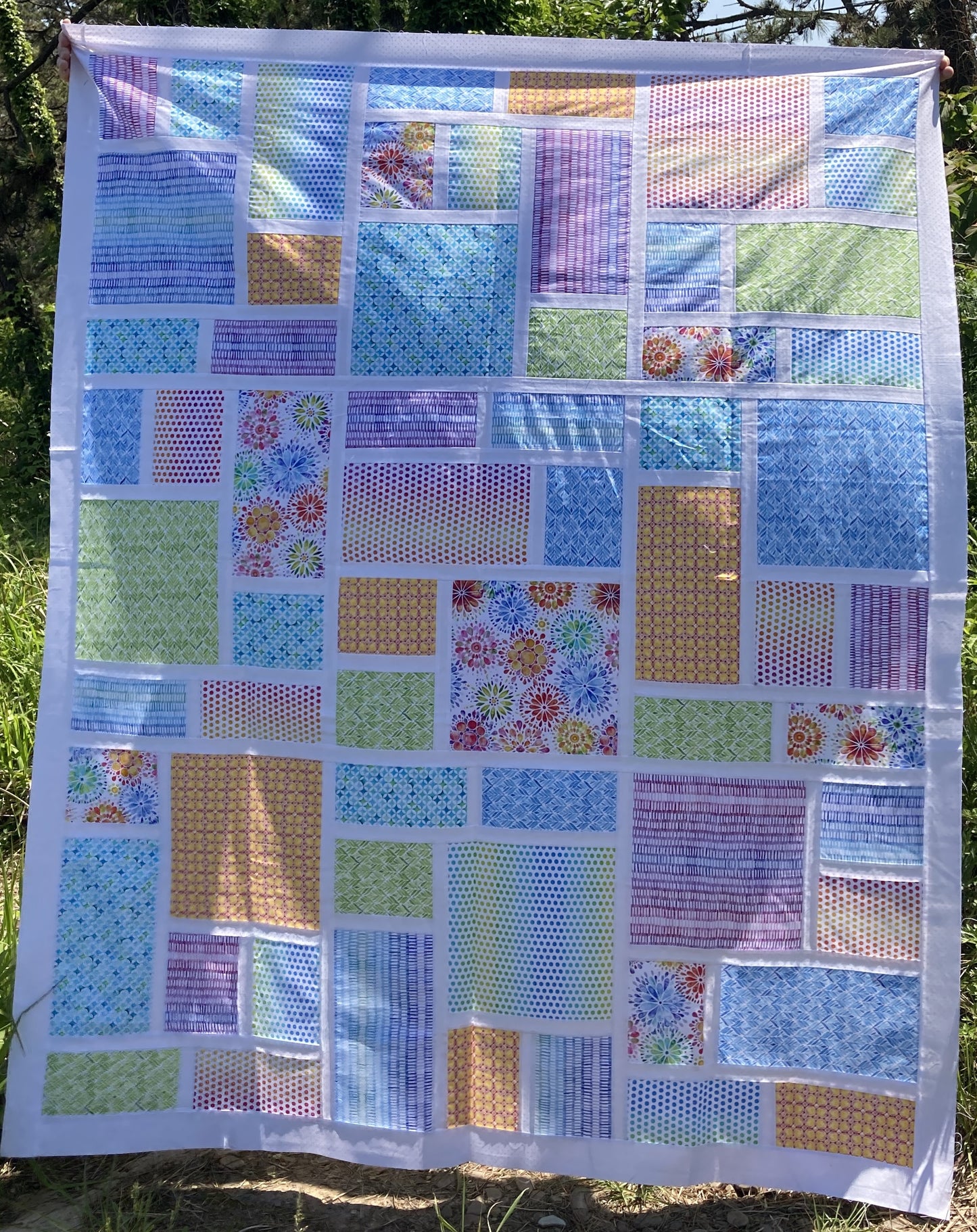 Slea Head Quilt, Throw size in rainbow and white.